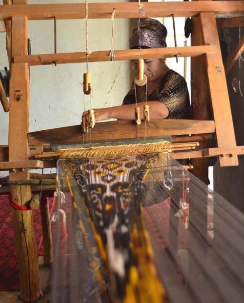 Uzbek woman weaving silk ikat velvet