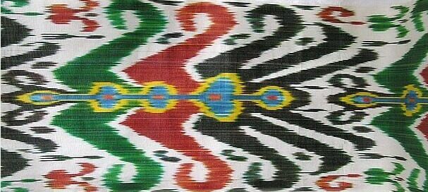 Multicolor Uzbek red green black and white cotton ikat fabric