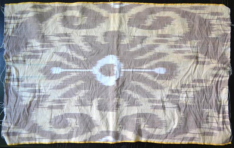 Beige and brown cotton silk ikat fabric that was hand washed, hang dried but not yet ironed.